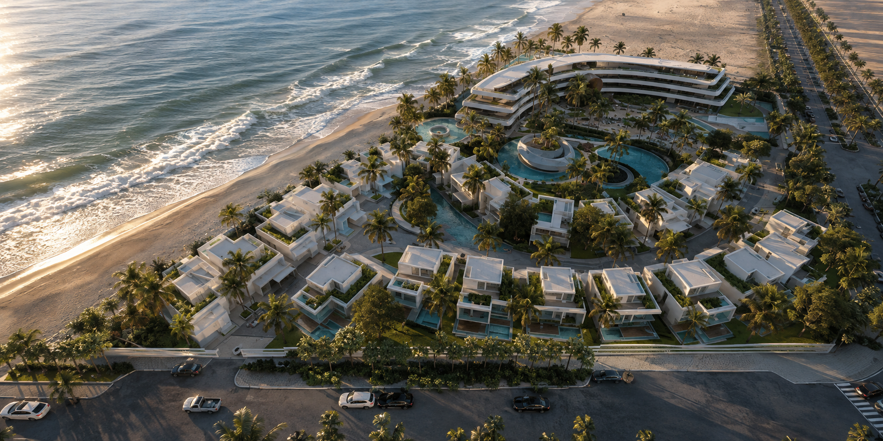 Vivienda Resort — aerial view of the coastal resort at sunset with villas, pools, and the Red Sea shoreline