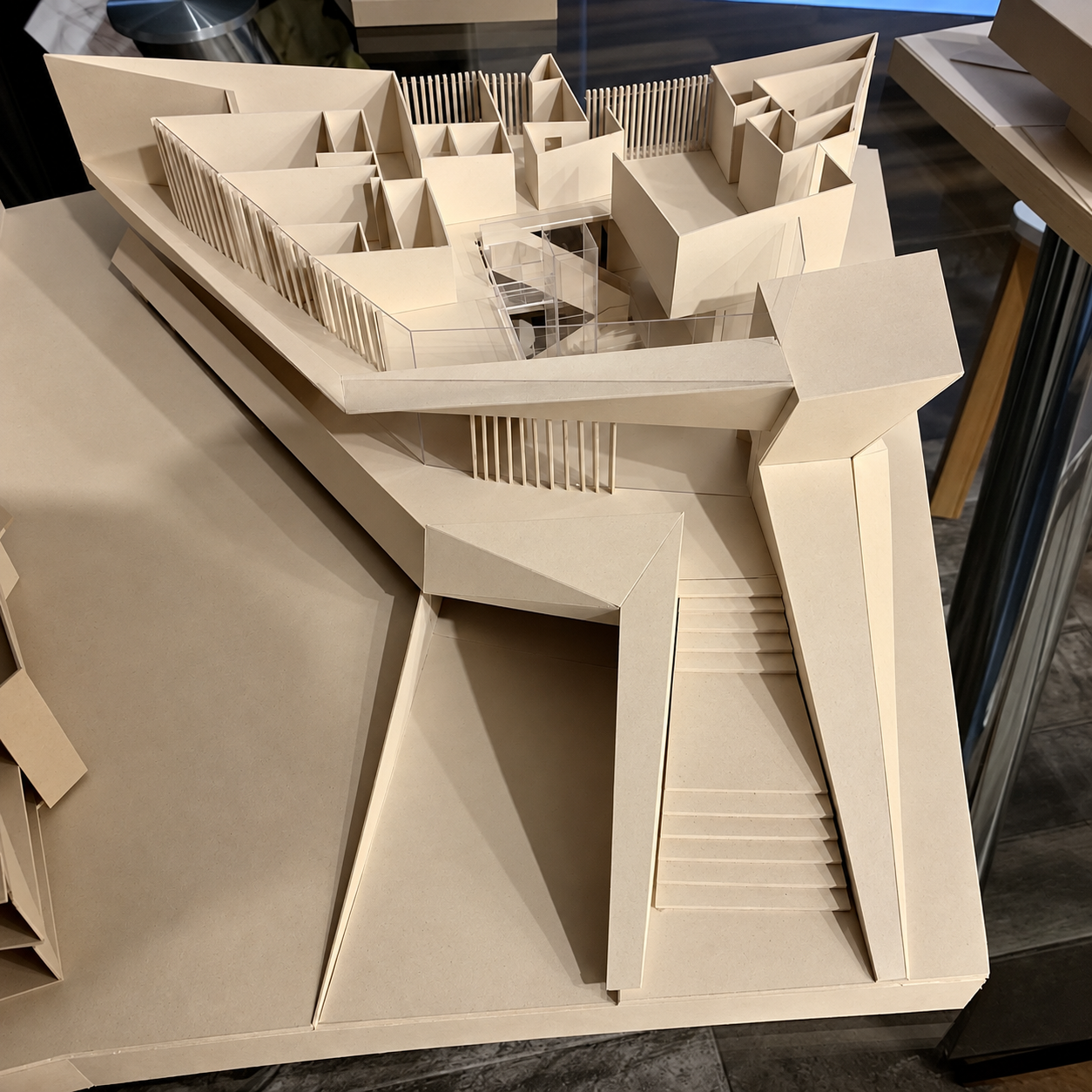 Studio model of Alexence Villa, a card study showing the layered roof planes, terraces, grand entrance stair and louvered screens