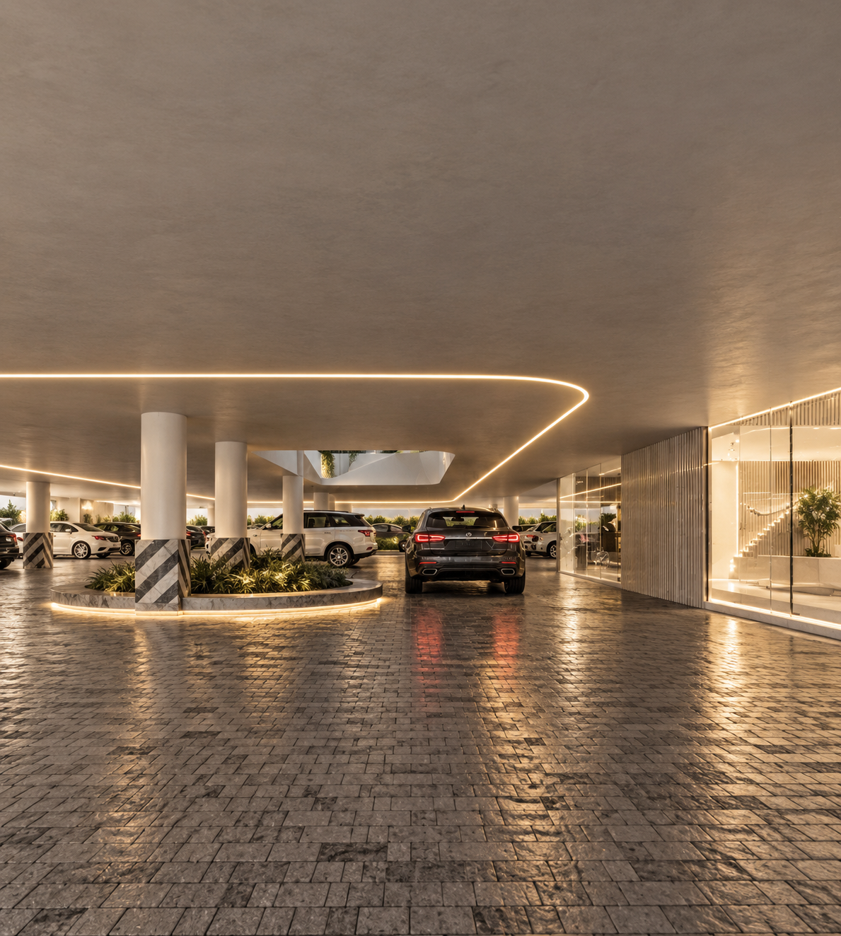 MYSORI INDIA — elegant covered parking with illuminated columns, landscaped islands and reflective cobblestone paving