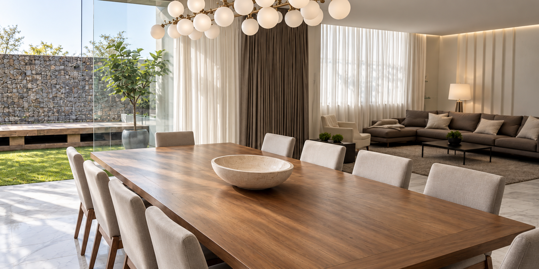 Dining and living area of Cedros House opening to the garden through full height glass