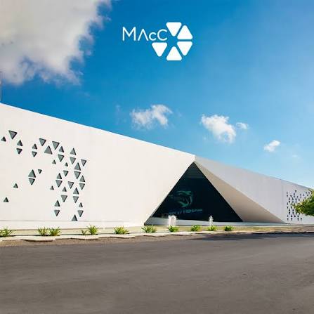 MACC ACADEMY — sculptural white entrance facade with the MAAC logo and geometric brise-soleil openings
