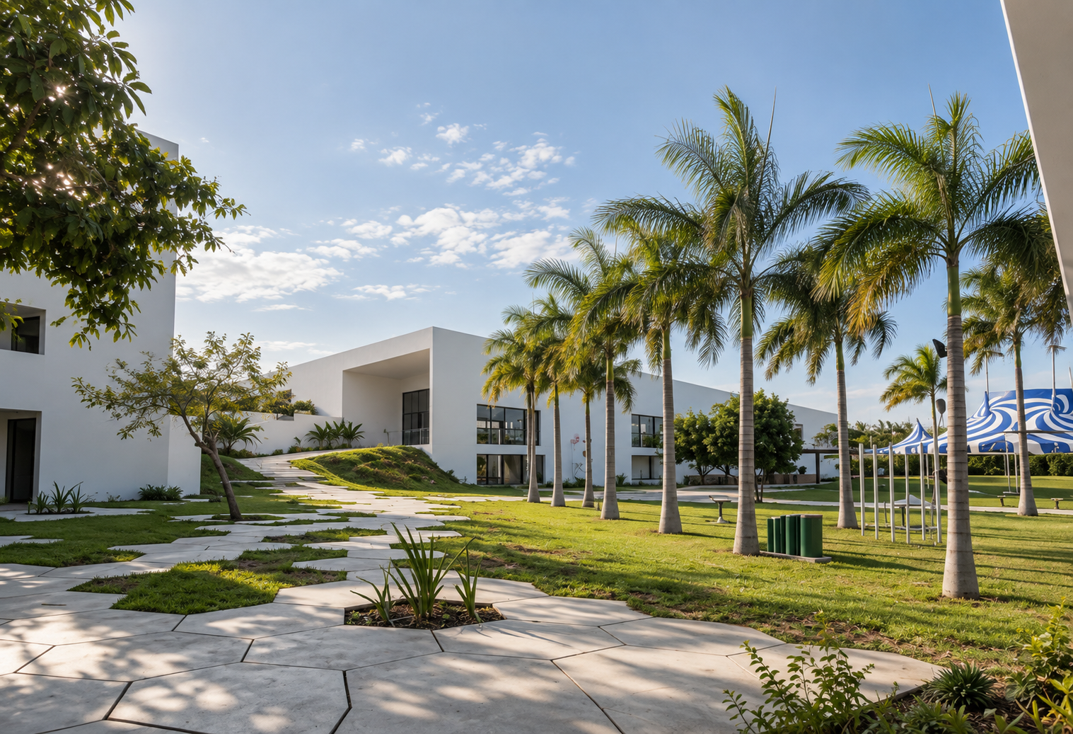 MACC ACADEMY — tropical campus gardens with palm-lined pathways, white classroom volumes and hexagonal stone pavers