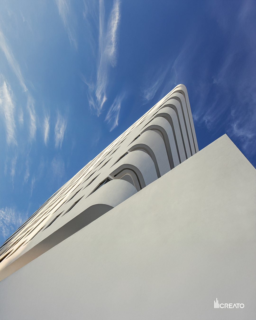 Verona Tower — sculptural facade rising into a blue sky