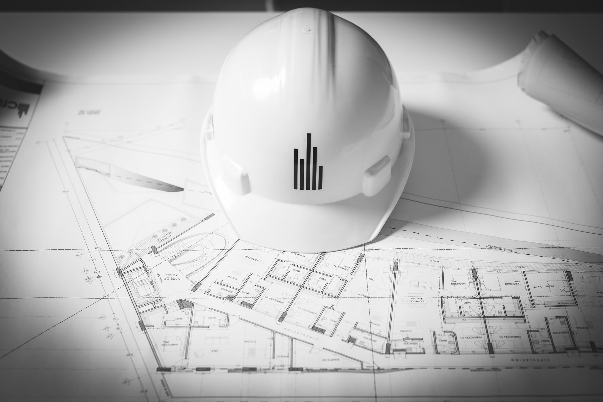 Construction documents and site helmet on a CREATO project